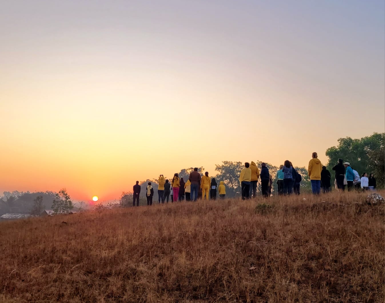 Retreat group walking out to watch the sunrise over open country