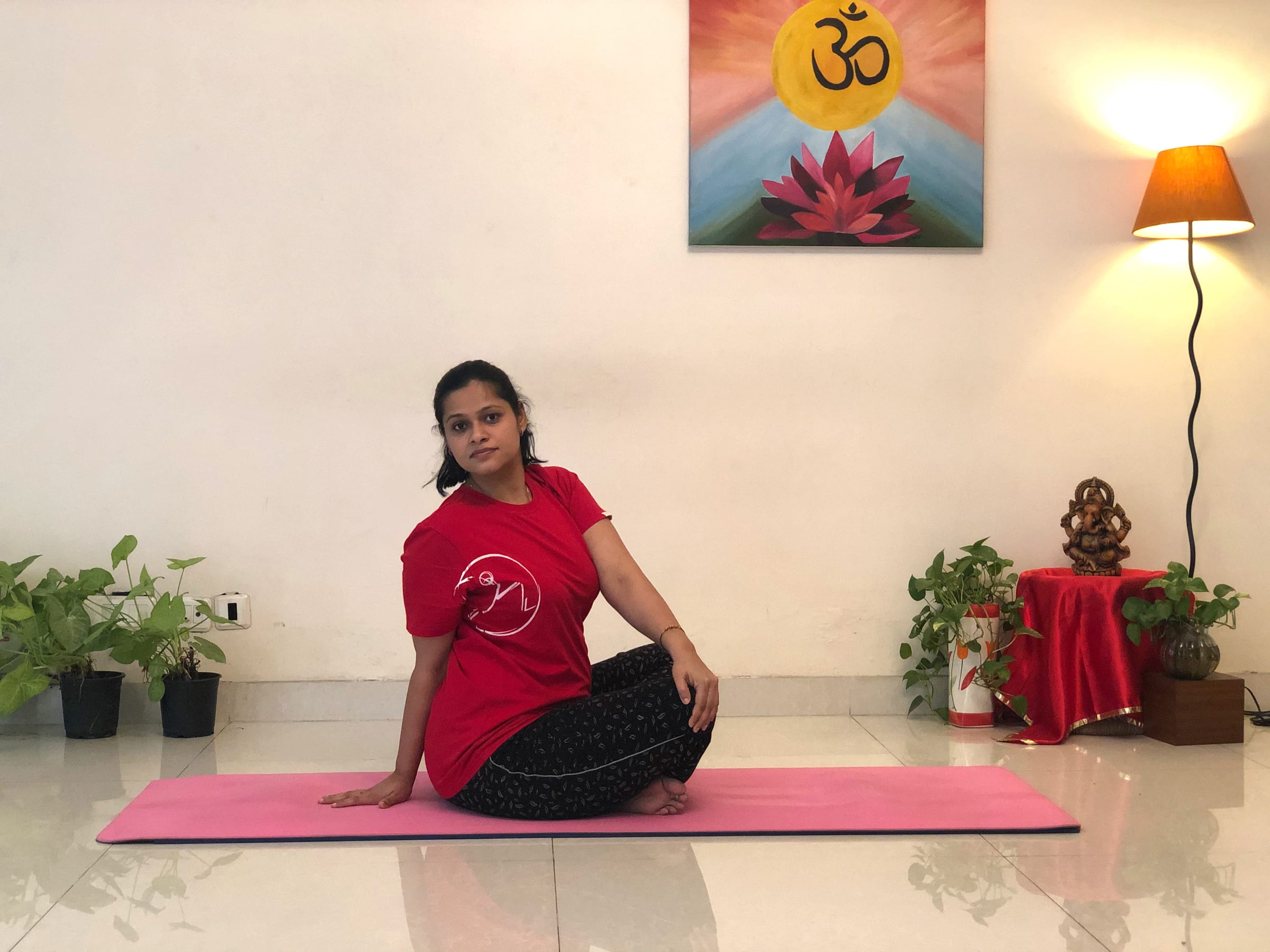 Priti in a seated twist at Sivananda Yoga Centre Gurgaon